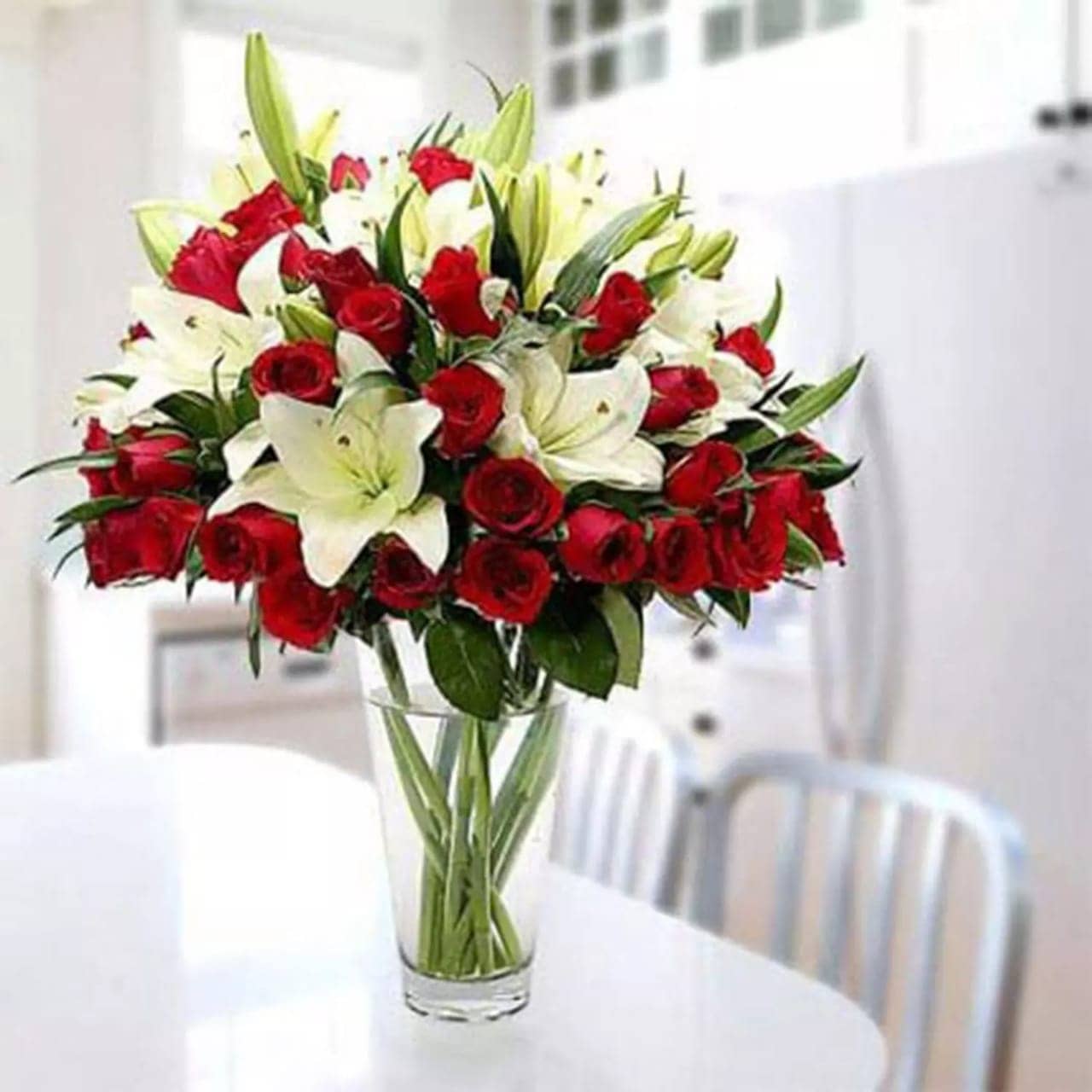 5 long stems of lilies and 25 red roses
