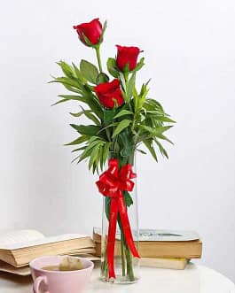 Red roses in glass vase - TheFlowers.PK