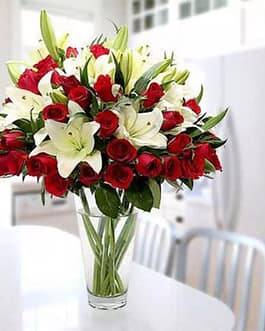 5 long stems of lilies and 25 red roses