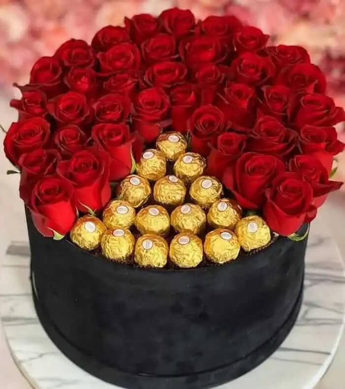 Imported Red Roses and original Italian Ferrero Rochers in round hatbox - theflowers.pk