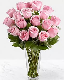 24 pink roses in a glass vase